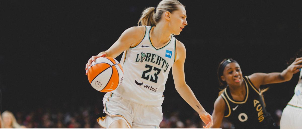 Marine Johannes (23) sustained the Liberty in the early going but they failed to contain Jackie Young (0) and the Aces' other scorers
